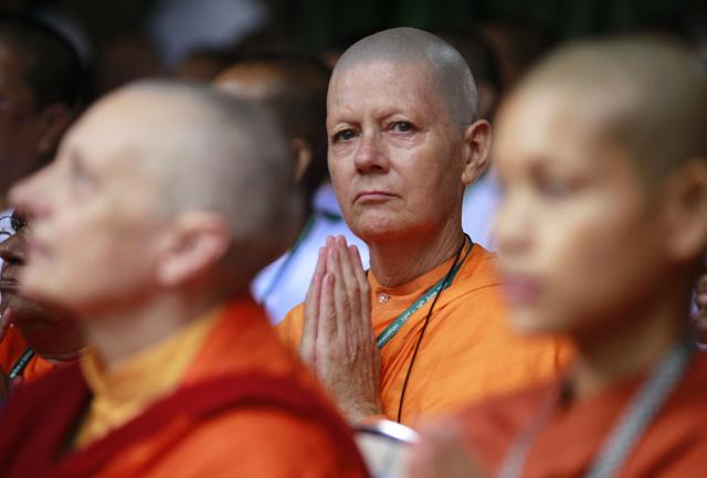 A Buddhist nun prays during the opening ceremony of the 12th Sakyadhita International Conference on Buddhist Women, with the theme "Leading to Liberation", at Sathira-Dhammasathan in Bangkok June 12, 2011. (REUTERS) A Buddhist nun prays during the opening ceremony of the 12th Sakyadhita International Conference on Buddhist Women, with the theme "Leading to Liberation", at Sathira-Dhammasathan in Bangkok June 12, 2011. (REUTERS)