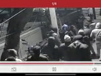 A police official hits the woman twice after she tried to stop him from hitting the man who was being taken to the custody, A police official hits the woman twice after she tried to stop him from hitting the man who was being taken to the custody,