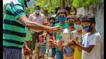 NGO workers distribute milk at a village during the nationwide lockdown due to the coronavirus pandemic, Santipur, April 4, 2020 (PTI) NGO workers distribute milk at a village during the nationwide lockdown due to the coronavirus pandemic, Santipur, April 4, 2020 (PTI)