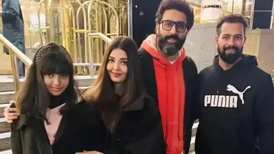 Aaradhya Bachchan, Aishwarya Rai, and Abhishek Bachchan pose with fan in New York. Aaradhya Bachchan, Aishwarya Rai, and Abhishek Bachchan pose with fan in New York.