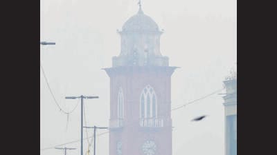 Fog engulfs the Clock Tower in Ludhiana, as commuters brave the bone-chilling cold on Tuesday. The maximum temperature on the day dipped to 10.2 °C, 7.3°C below normal. (Gurpreet Singh/HT)