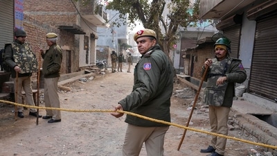 New Delhi: Delhi Police personnel deployed near the residence of the girl who was killed after being dragged by a car, at Karan Vihar area of Sultanpuri, in New Delhi, Tuesday, Jan. 3, 2023. (PTI Photo/Arun Sharma)