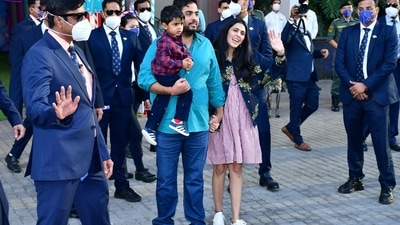 In the pictures, Akash Ambani was seen holding his little one, who was dressed in a checked shirt paired with black pants and shoes. (HT Photo/Varinder Chawla)