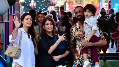 Natasa Stankovic, Krunal Pandya, Pankhuri Sharma pose with their children for the shutternbugs. (HT Photo/Varinder Chawla)