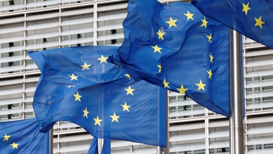 European Union flags flutter outside the EU Commission headquarters in Brussels, Belgium.(Reuters)