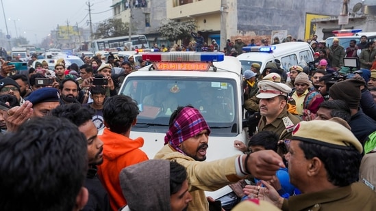 Body of the 20-year-old woman, being taken for cremation from her residence, at Karan Vihar area of Sultanpuri, in New Delhi, Tuesday. (PTI)