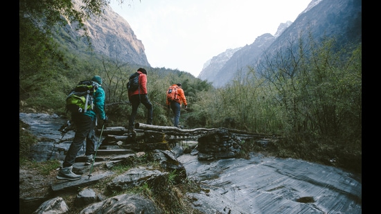 Group of trekkers cross the bridge at Annapurna region on Himalayas. (Getty Images/iStockphoto)