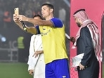 Al-Nassr's new Portuguese forward Cristiano Ronaldo (C) poses for a selfie with the presenters during his unveiling at the Mrsool Park Stadium in the Saudi capital Riyadh on January 3, 2023. (Photo by AFP) Al-Nassr's new Portuguese forward Cristiano Ronaldo (C) poses for a selfie with the presenters during his unveiling at the Mrsool Park Stadium in the Saudi capital Riyadh on January 3, 2023. (Photo by AFP)