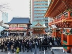 Visitors line up to offer prayers on the first business day of the year at the Kanda Myojin shrine in Tokyo, Japan. Japan to toughen border control for travellers on direct flight from China (Photographer: Noriko Hayashi/Bloomberg) Visitors line up to offer prayers on the first business day of the year at the Kanda Myojin shrine in Tokyo, Japan. Japan to toughen border control for travellers on direct flight from China (Photographer: Noriko Hayashi/Bloomberg)