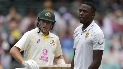 South Africa's Kagiso Rabada, right, turns away after Australia's Marnus Labuschagne, left, hits a boundary during the first day of their cricket test match at the Sydney Cricket Ground in Sydney, Wednesday, Jan. 4, 2023. (AP) South Africa's Kagiso Rabada, right, turns away after Australia's Marnus Labuschagne, left, hits a boundary during the first day of their cricket test match at the Sydney Cricket Ground in Sydney, Wednesday, Jan. 4, 2023. (AP)