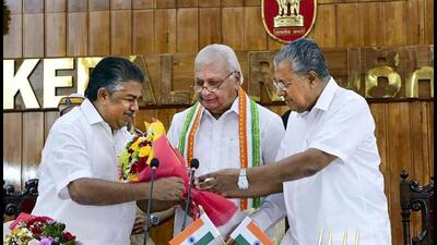Kerala Governor Arif Mohammad Khan and chief mMinister Pinarayi Vijayan present a bouquet to MLA Saji Cheriyan after the latter took oath as a state cabinet minister, at Raj Bhawan in Thiruvananthapuram on Wednesday. (PTI) Kerala Governor Arif Mohammad Khan and chief mMinister Pinarayi Vijayan present a bouquet to MLA Saji Cheriyan after the latter took oath as a state cabinet minister, at Raj Bhawan in Thiruvananthapuram on Wednesday. (PTI)