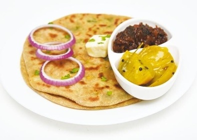 Onion stuffed parathas with pickles are very fulfilling. (Shutterstock)