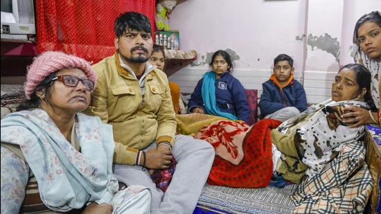 Family members of 20-year-old Anjali Kumari in Sultanpuri in New Delhi on Wednesday. (PTI)