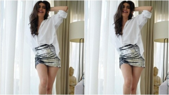 Karishma decked up in a white shirt and tucked it inside a silver sequined pencil short skirt.&nbsp;(Instagram/@karishmaktanna)