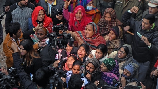 Sultanpuri horror updates: Family members of a woman, who lost her life after being dragged by a car for several kilometres, wail while speaking to the media after the woman's mortal remains reached the residence for last rites, in the Sultanpuri area, in New Delhi on Tuesday.