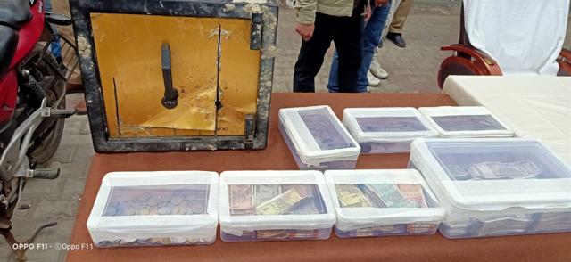 The police have recovered ₹12,25,631 allegedly from the suspects along with the safe and the grinder used to break it open. Three country-made pistols with five live bullets and a red Pulsar motorcycle have also been seized, said police. (HT Photo) The police have recovered ₹12,25,631 allegedly from the suspects along with the safe and the grinder used to break it open. Three country-made pistols with five live bullets and a red Pulsar motorcycle have also been seized, said police. (HT Photo)