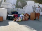 Belongings of people seen outside a house where a crack developed as a result of the continued land subsidence, in Joshimath, Uttarakhand. (ANI Photo)