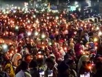 Residents take out a candle march against the Uttarakhand High Court's order for removal of encroachments from the railway land, in Haldwani. 