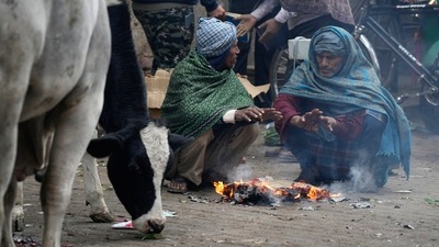 People warm themselves near a bonfire on a cold winter morning, in New Delhi, on January 4. Cold northwesterly winds on the day sent Delhi’s minimum temperature to a season-low of 4.4 degrees Celsius. (Shahbaz Khan / PTI) People warm themselves near a bonfire on a cold winter morning, in New Delhi, on January 4. Cold northwesterly winds on the day sent Delhi’s minimum temperature to a season-low of 4.4 degrees Celsius. (Shahbaz Khan / PTI)