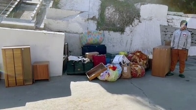 Belongings of people seen outside a house where a crack developed as a result of the continued land subsidence, in Joshimath, Uttarakhand. (ANI Photo)