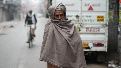 An elderly person braces the weather on a cold winter morning in New Delhi. (ANI Photo) An elderly person braces the weather on a cold winter morning in New Delhi. (ANI Photo)