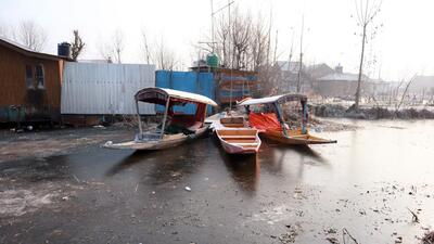 Boats on frozen Dal Lake. (ANI)