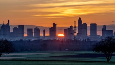 Covid In Germany: The sun rises behind the buildings of the banking district in Frankfurt, Germany. (AP)