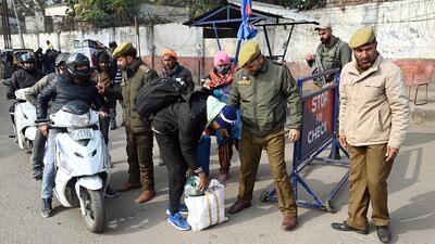 Jammu and Kashmir Police personnel conduct a security check after the recent terror attacks at Dhangri village of Rajouri district, in Jammu on Thursday. (ANI)