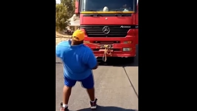 Man pulls truck with teeth. (Instagram/@guinnessworldrecords)