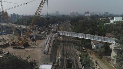 Steel girder being installed at Sangamwadi railway crossing line. (HT PHOTO)