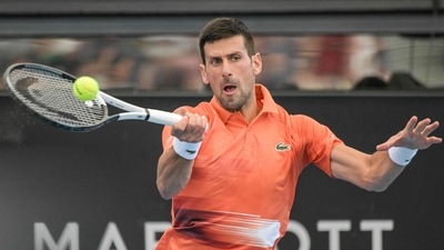 Serbia's Novak Djokovic hits a return against France's Quentin Halys during their men's singles match at the Adelaide International tennis tournament in Adelaide on January 5, 2023. (Photo by Brenton EDWARDS / AFP) / - IMAGE RESTRICTED TO EDITORIAL USE - STRICTLY NO COMMERCIAL USE- (AFP) Serbia's Novak Djokovic hits a return against France's Quentin Halys during their men's singles match at the Adelaide International tennis tournament in Adelaide on January 5, 2023. (Photo by Brenton EDWARDS / AFP) / - IMAGE RESTRICTED TO EDITORIAL USE - STRICTLY NO COMMERCIAL USE- (AFP)