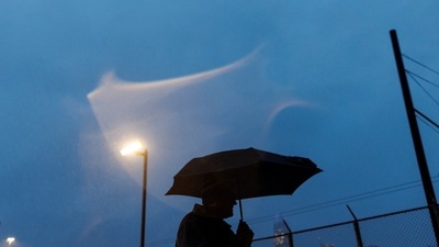 California Storm Alert: A local resident waits in downtown San Francisco. (Reuters)