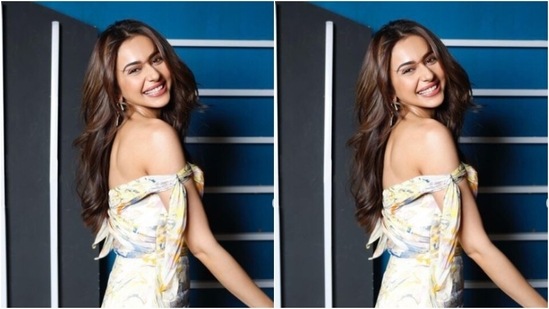 Styled by fashion stylist Anshika Verma, Rakul Preet wore her tresses open in wavy curls with a middle part as she smiled with all her heart for the cameras. (Instagram/@rakulpreet)