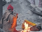 A man huddled around a bonfire during morning hours amid cold weather at IP Extension, in New Delhi. (Sanjeev Verma/HT Photo) A man huddled around a bonfire during morning hours amid cold weather at IP Extension, in New Delhi. (Sanjeev Verma/HT Photo)