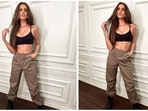Tara Sutaria is exploring new fashion trends this new year. The young fashionista enjoys a following of 8.2 million on Instagram and she makes sure to keep them updated with all her doings. Her latest set of pictures features the actor in a basic black crop top and cargo pants. (Instagram/@tarasutaria)