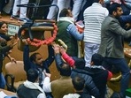 AAP and BJP Delhi councillors clash during the oath ceremony and election of mayor and deputy mayor at the MCD Civic Centre in New Delhi on Friday, (Raj K Raj/ HT photo) AAP and BJP Delhi councillors clash during the oath ceremony and election of mayor and deputy mayor at the MCD Civic Centre in New Delhi on Friday, (Raj K Raj/ HT photo)