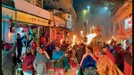 Residents of Joshimath take out a procession to protest land subsidence that has caused cracks in at least 500 homes, on Wednesday night. (ANI) Residents of Joshimath take out a procession to protest land subsidence that has caused cracks in at least 500 homes, on Wednesday night. (ANI)