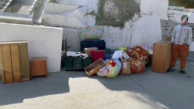 Belongings of people seen outside a house where a crack developed as a result of the continued land subsidence, in Joshimath, Uttarakhand. (ANI Photo) Belongings of people seen outside a house where a crack developed as a result of the continued land subsidence, in Joshimath, Uttarakhand. (ANI Photo)