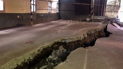 Cracks appear in a badminton court due to landslides, in the Joshimath of Uttarakhand, Friday. (PTI) Cracks appear in a badminton court due to landslides, in the Joshimath of Uttarakhand, Friday. (PTI)