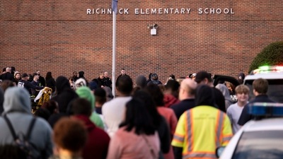 Students and police gather outside of Richneck Elementary School after a shooting. (AP)