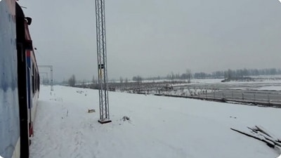 The image shows a train passing through snow-clad Jammu and Kashmir valley. (Twitter/@RailMinIndia)
