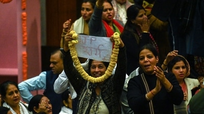 The oathtaking was stopped and the meeting was disrupted as the AAP councillors stood on the tables raising slogans against BJP. (Raj K Raj/ HT Photo)