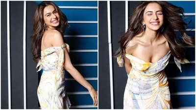 Earlier, Rakul had shared pictures from another promotional photoshoot on Instagram. It shows the star dressed in a colourful printed gown featuring an off-the-shoulder neckline, frilled details on the hem, cinched waistline, and a flowy silhouette. (Instagram) Earlier, Rakul had shared pictures from another promotional photoshoot on Instagram. It shows the star dressed in a colourful printed gown featuring an off-the-shoulder neckline, frilled details on the hem, cinched waistline, and a flowy silhouette. (Instagram)