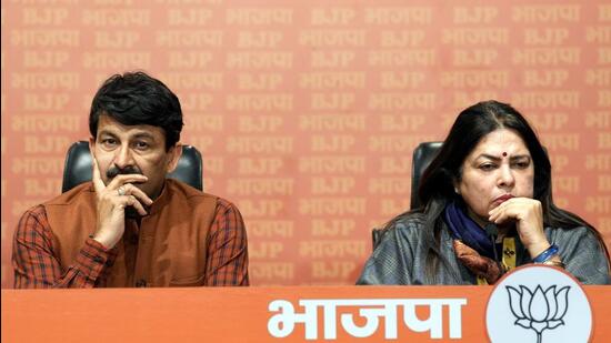 Bharatiya Janata Party MP Manoj Tiwari with union minister Meenakashi Lekhi during a press conference over the clash during the election of Mayor and Deputy Mayor of MCD at the Civic Centre in New Delhi on Friday. (PTI)