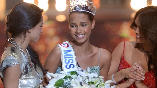 Miss France Contest Controversy: Miss France Indira Ampiot (C) celebrates with Miss France 2005 Cindy Fabre (L) and Miss France 2022 Diane Leyre (R). (AFP)