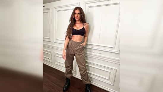 Tara Sutaria donned a black strappy crop top which she teamed with cargo pants and combat boots for her latest photoshoot. (Instagram/@tarasutaria)