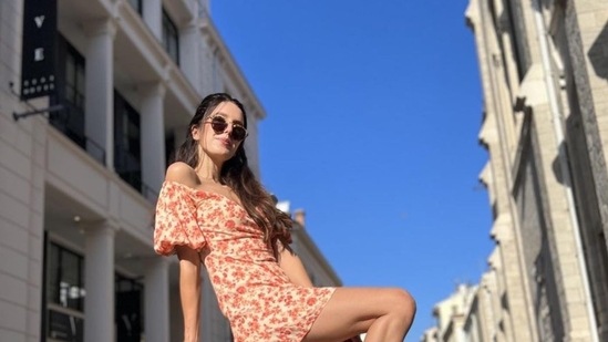 Earlier in June 2022, she posted her photos from France. Isabelle wore an orange dress as she posed at the French Riviera.