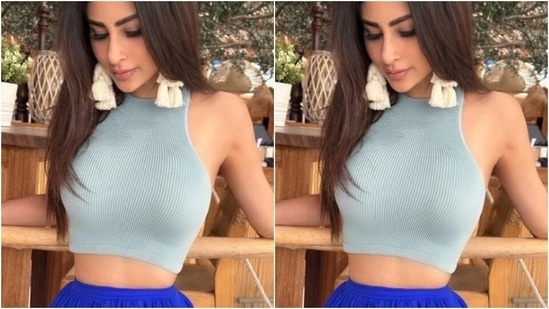Here’s a picture of Mouni ticking off boho vibes in a grey cropped top and a bright blue skirt, teamed with cotton white earrings.&nbsp;(Instagram/@imouniroy)