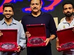  Indian cricketers Shardul Thakur (left), Ravi Shastri (former) and Ajinkya Rahane (right) are felicitated during the Mumbai Cricket Association (MCA) Annual Prize Distribution Function, at Sharad Pawar Cricket Academy Ground, in Mumbai, Friday, Jan. 6, 2023. 