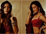 Rashmika Mandanna looks dreamy in beautiful red lehenga and deep-neck blouse set. (Instagram) Rashmika Mandanna looks dreamy in beautiful red lehenga and deep-neck blouse set. (Instagram)